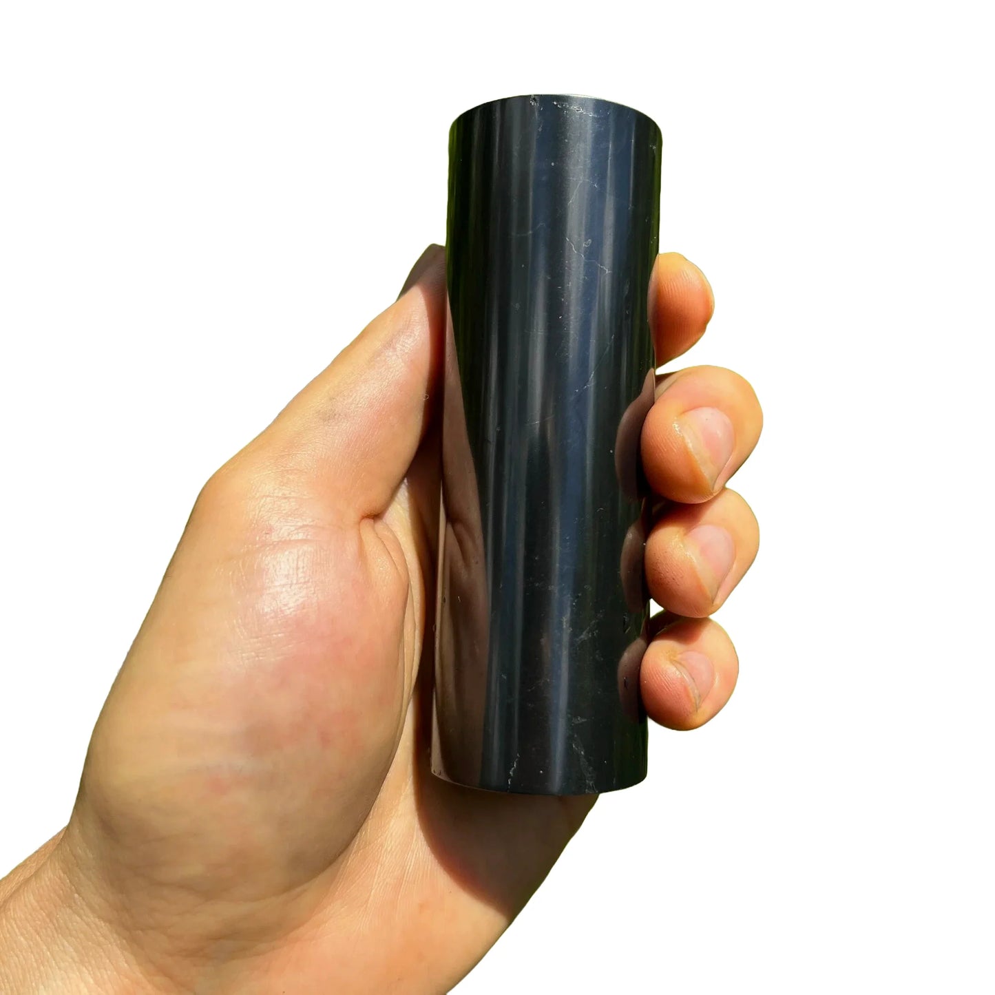 Reverse side of Shungite polished cylinder, showing natural texture, sourced from Russia.