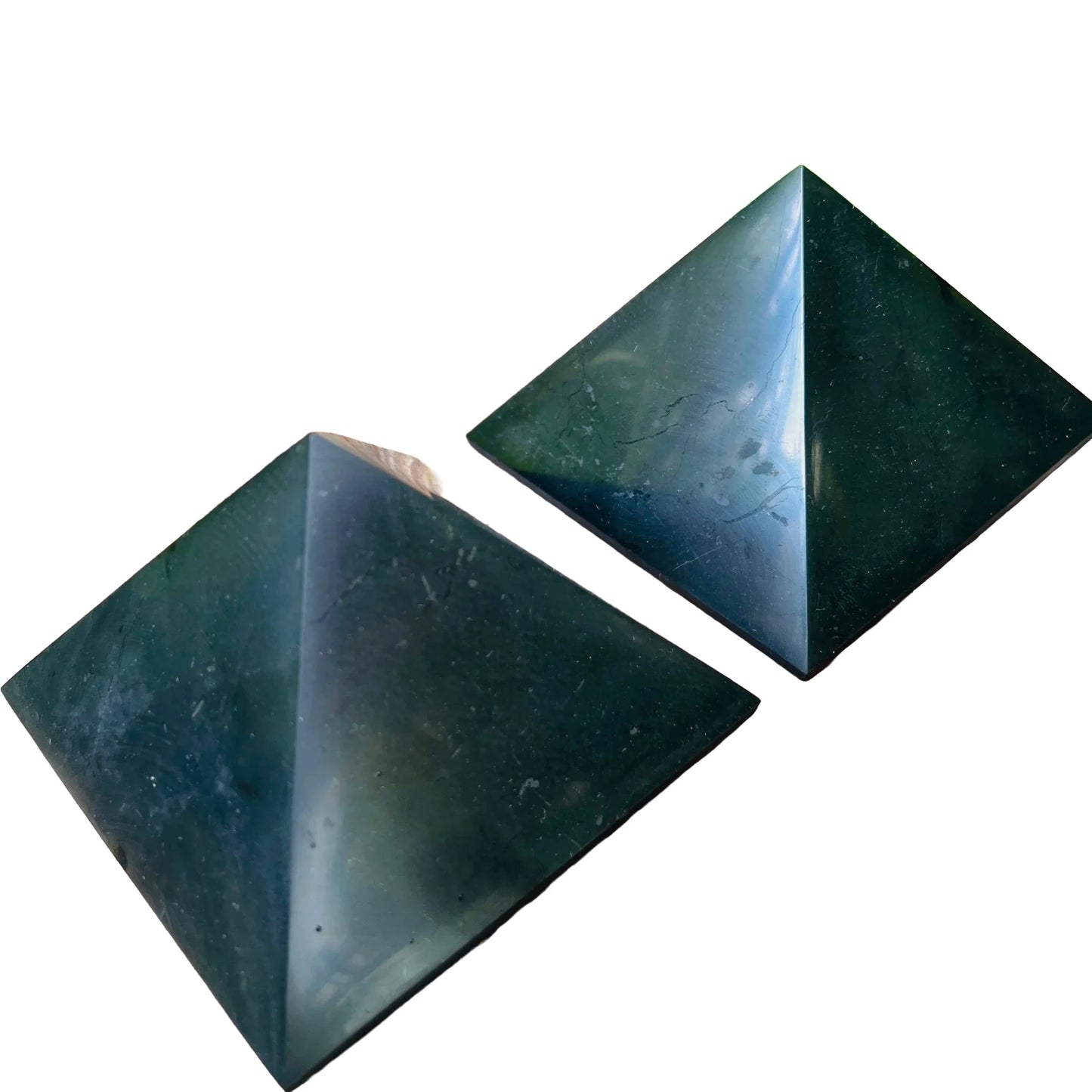 Natural surface of Shungite polished pyramid, often paired with practices around Protection.