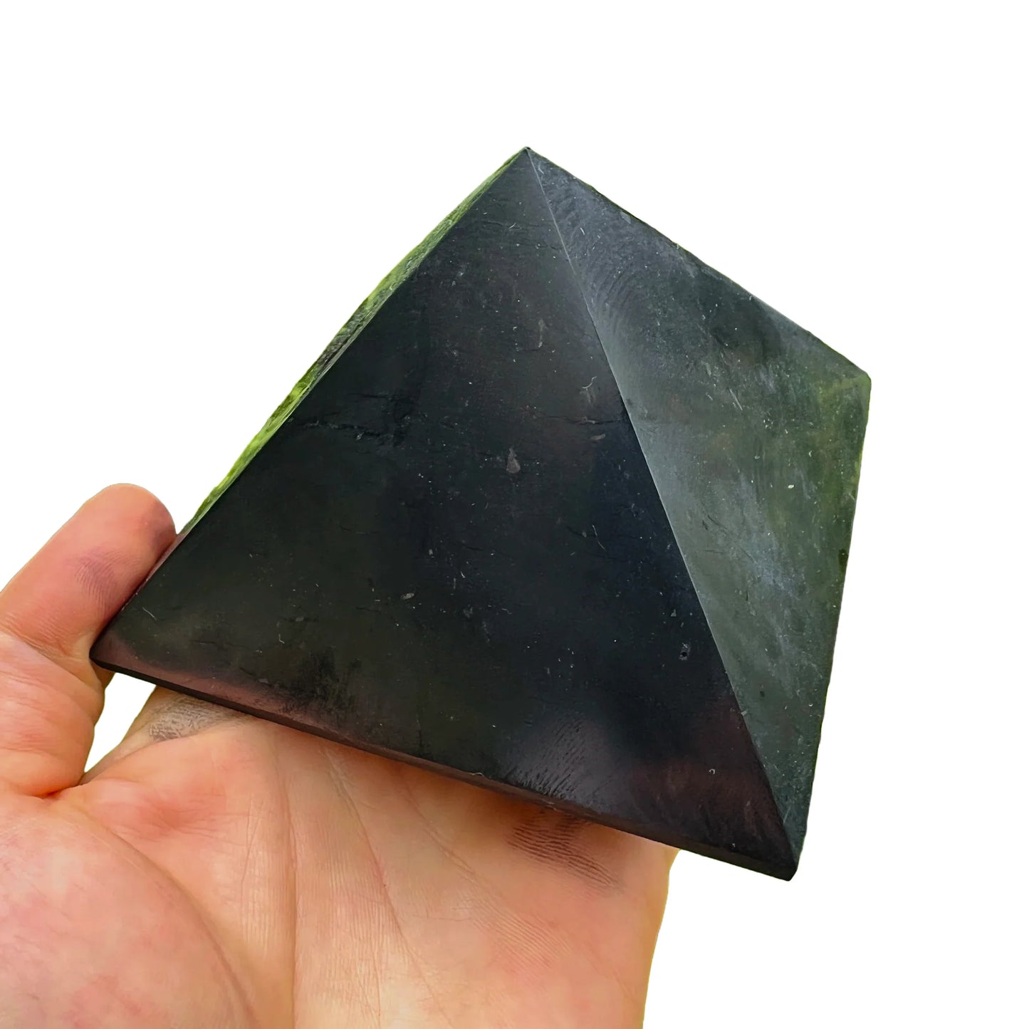 Top-down shot of Shungite polished pyramid, traditionally used for Protection and Cleansing, sourced from Russia.