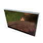 Profile shot of Shungite polished slab, showing translucent edges.