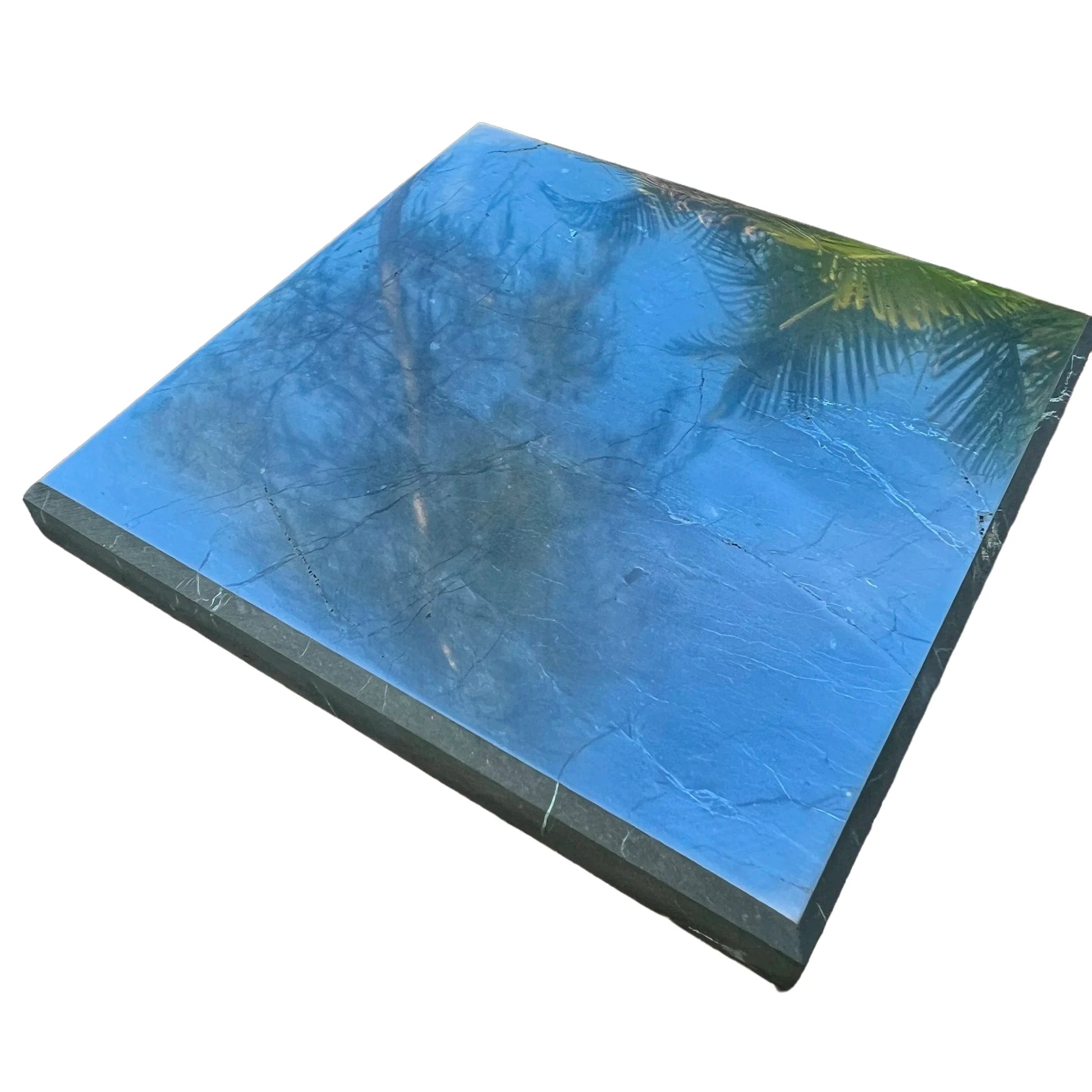 Top-down shot of Shungite polished slab, showing characteristic color, kept close for Protection.