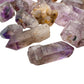 Smoky amethyst raw points blending smoky quartz and amethyst coloring, Masvingo, Zimbabwe