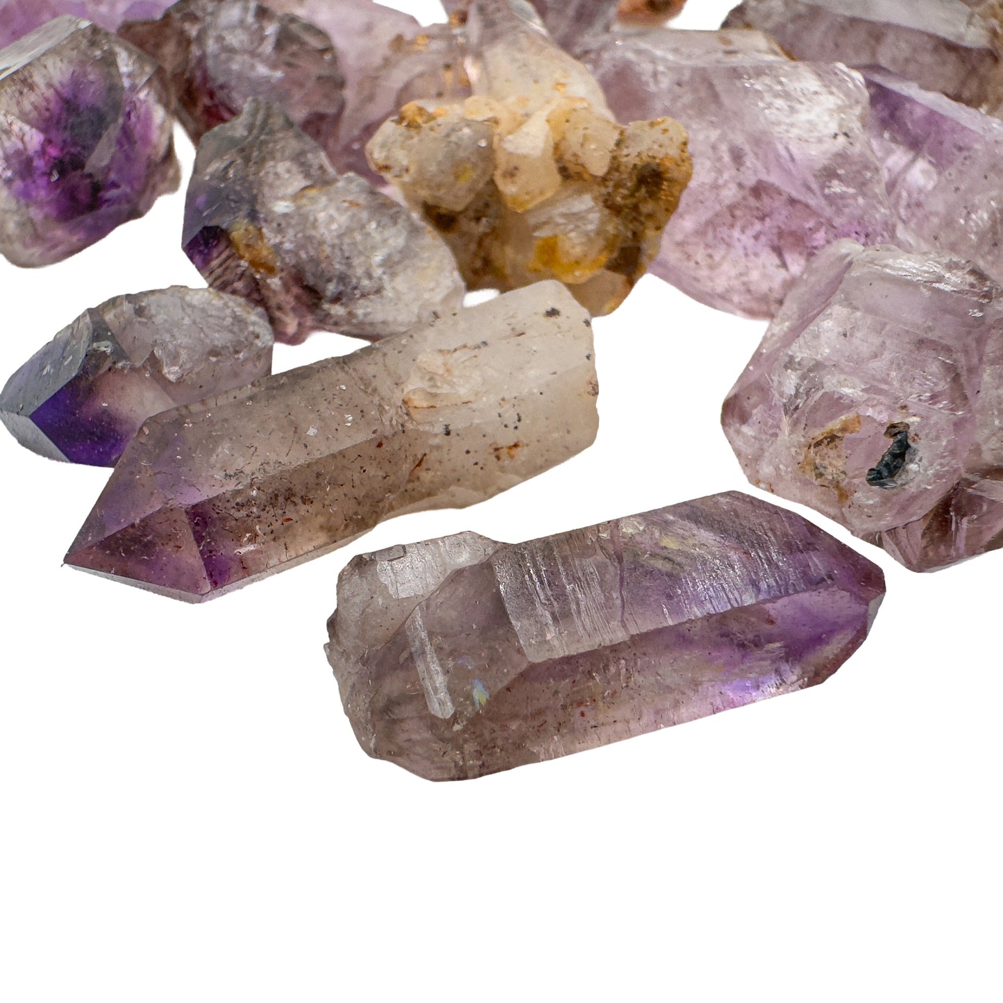 Smoky amethyst raw points blending smoky quartz and amethyst coloring, Masvingo, Zimbabwe