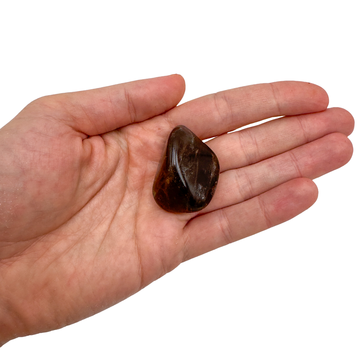 AA Grade Smoky Quartz tumbled stone held in hand for scale, from Madagascar