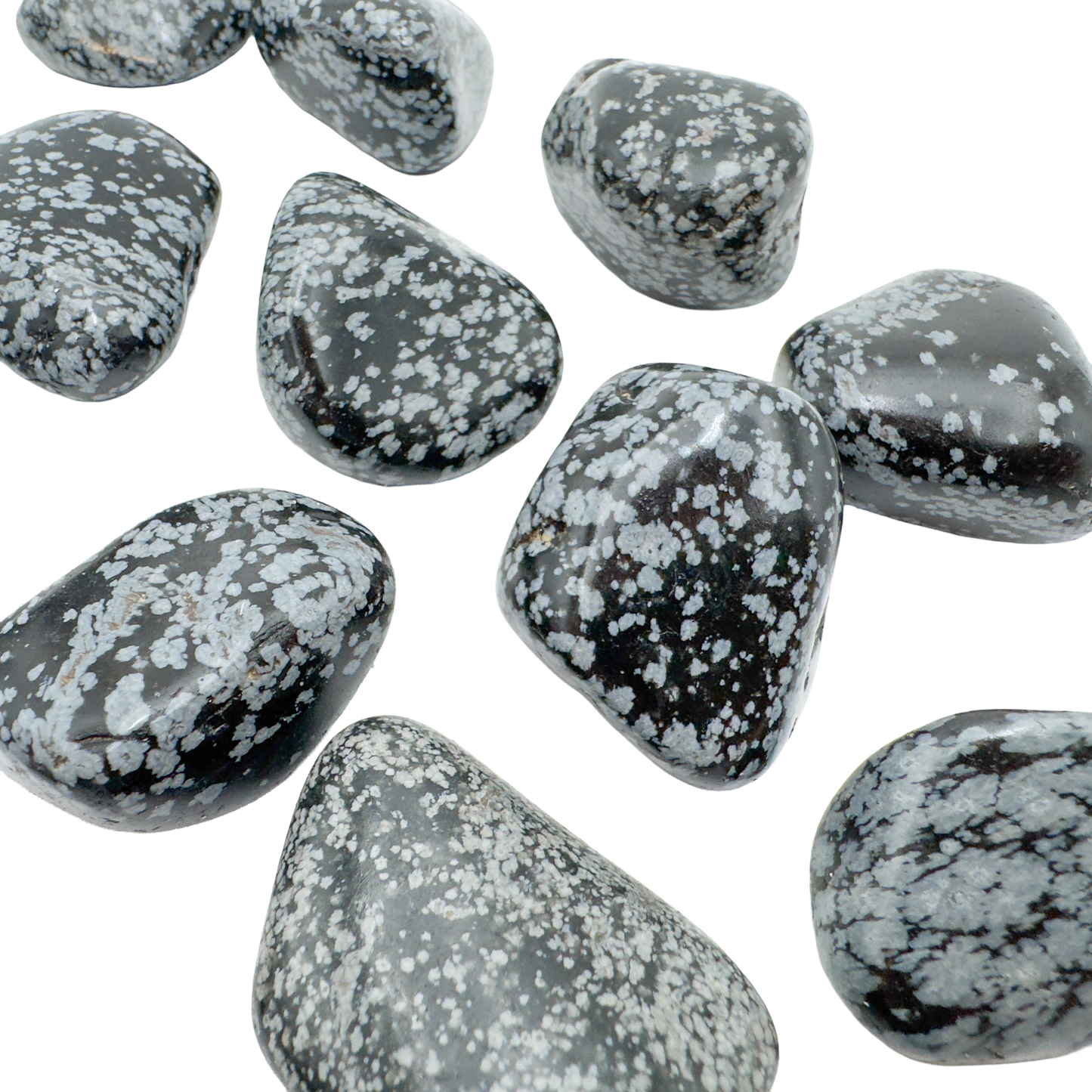 Several AA grade Snowflake Obsidian palm stones showing snowflake density variation