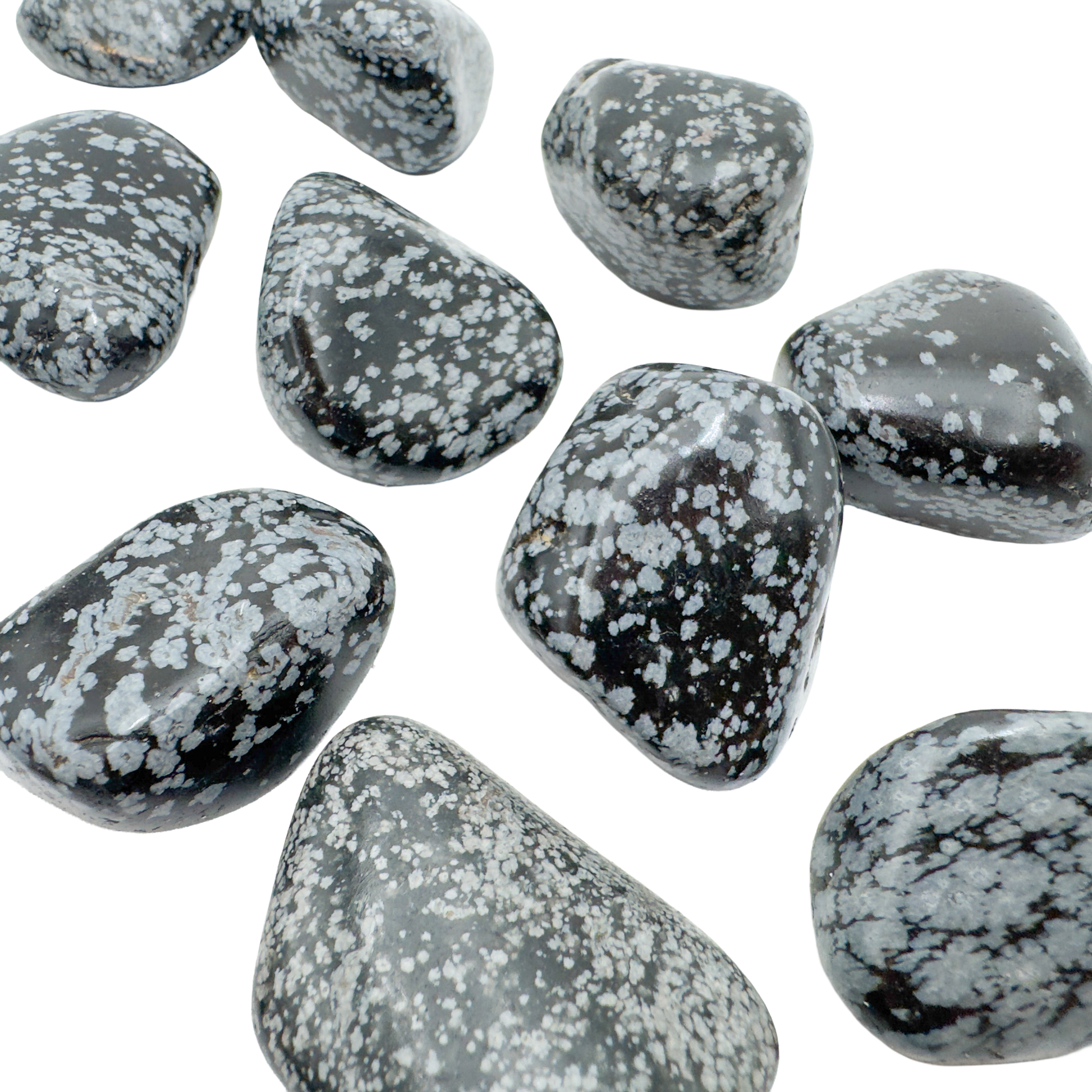 Several AA grade Snowflake Obsidian palm stones showing snowflake density variation