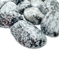 Snowflake Obsidian tumbled stone detail, cristobalite crystals formed as the volcanic glass cooled