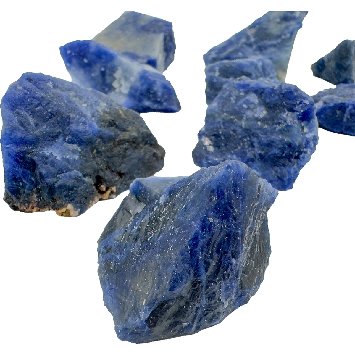 Close detail of Sodalite rough showing natural blue coloration and white inclusions, Grade AA