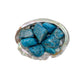 Color detail of Apatite tumbled stone, often kept for Focus and Manifestation, showing natural inclusions.