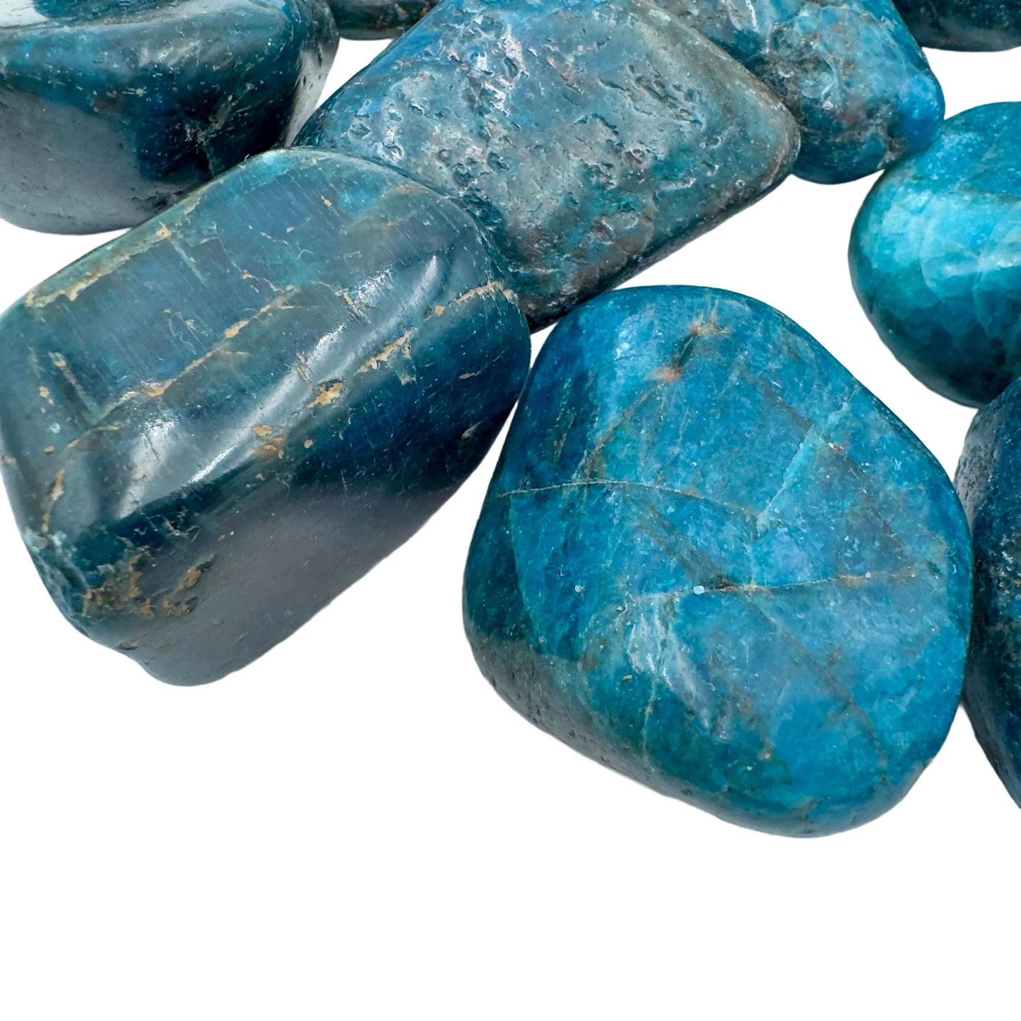 Side profile of Apatite tumbled stone, showing matte finish.