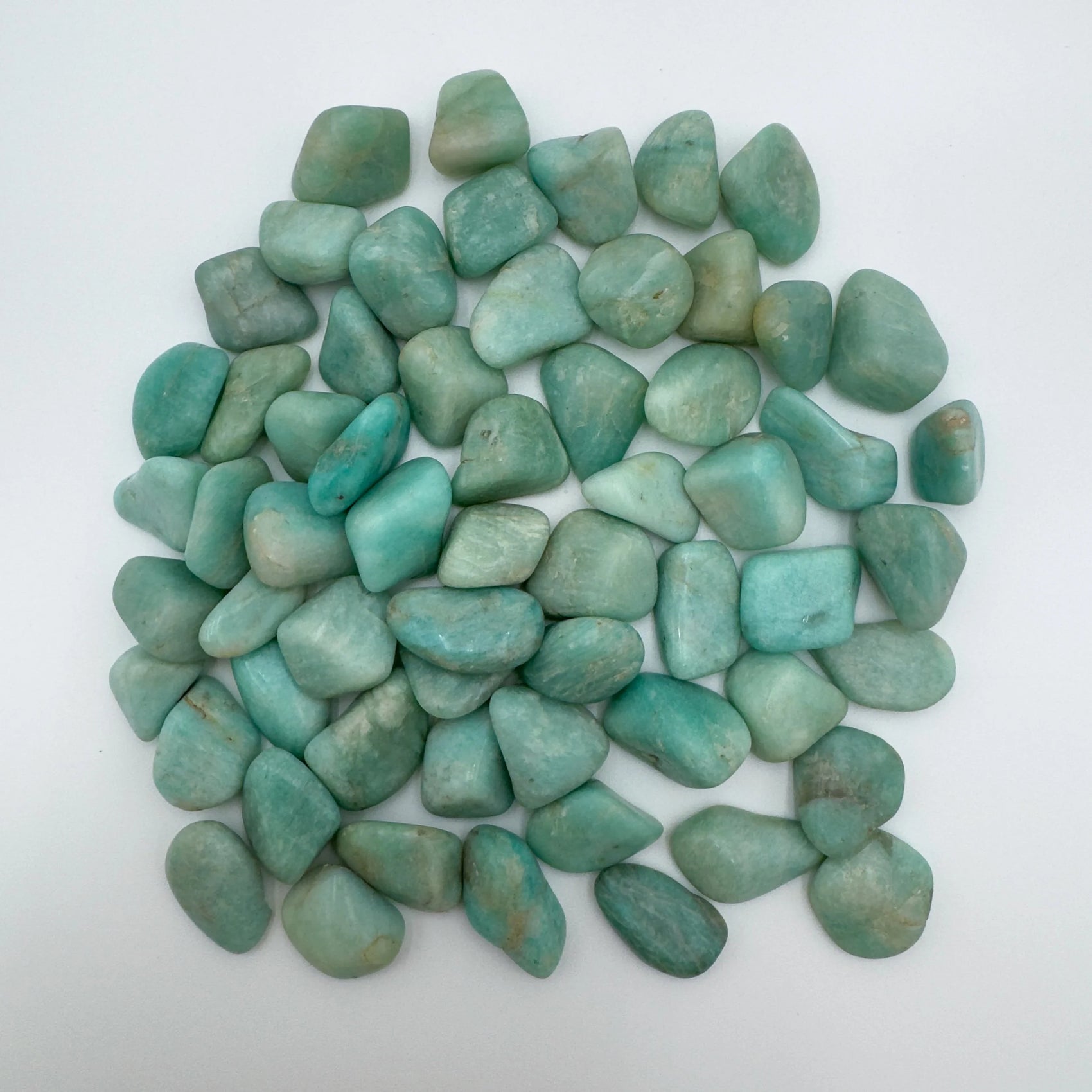 Close-up of Amazonite tumbled stone from Brazil, soothing wellness stone for Emotional Healing