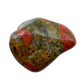Detail view of AA Grade Unakite tumbled stone from South Africa